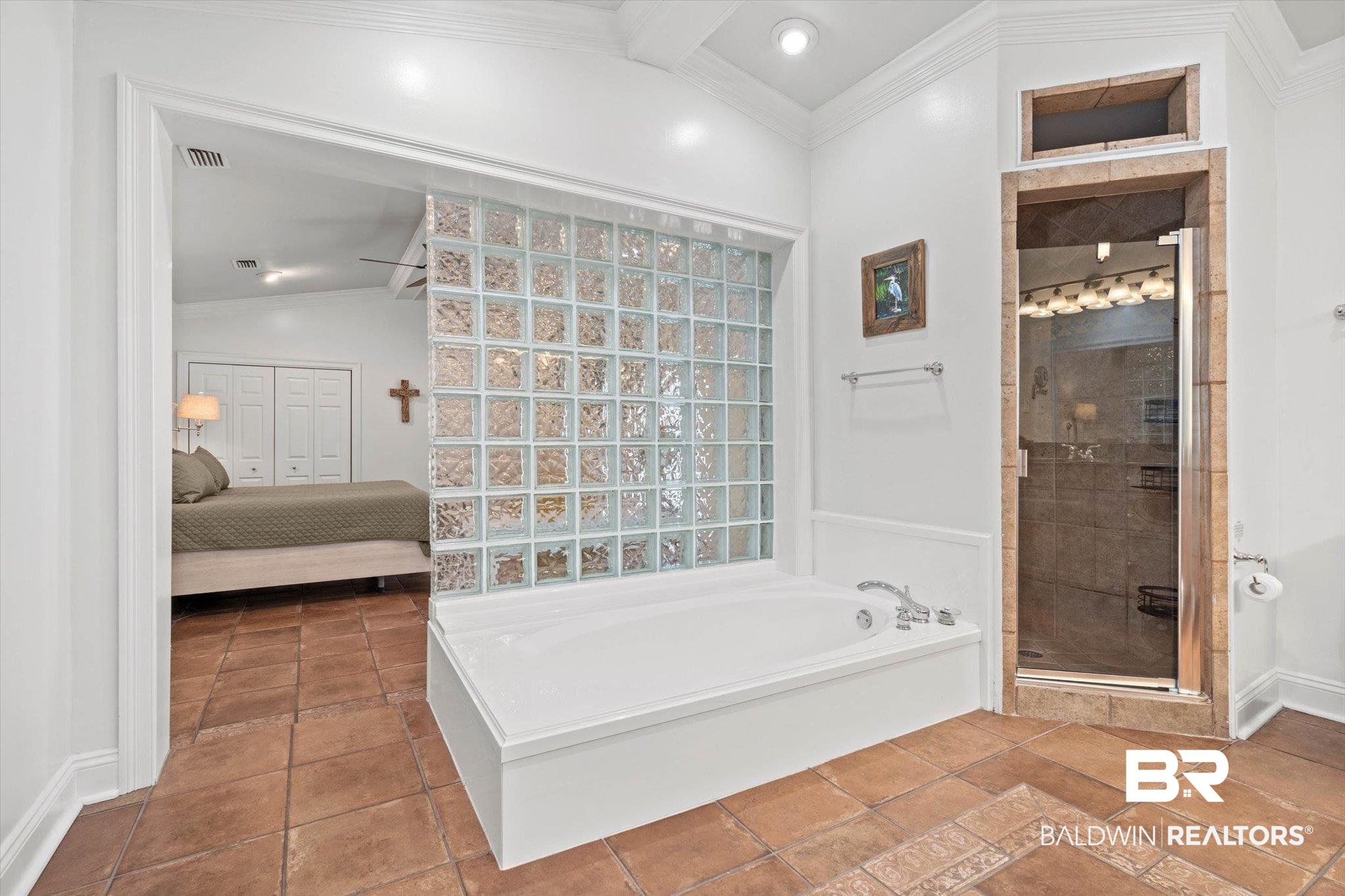 3720 Rabbit Creek Court Theodore, AL 36582 - Photo 13 of 47 Ensuite bathroom with crown molding, a garden tub, a shower stall, lofted ceiling, and tile patterned flooring