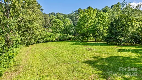 a view of outdoor space with deck and yard