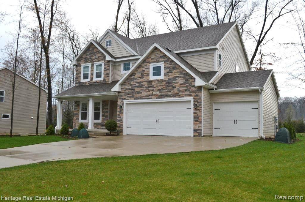 198 Slider Avenue Howell, MI 48843 - Photo 2 of 41 Ready for the landscaping and flowers to open!