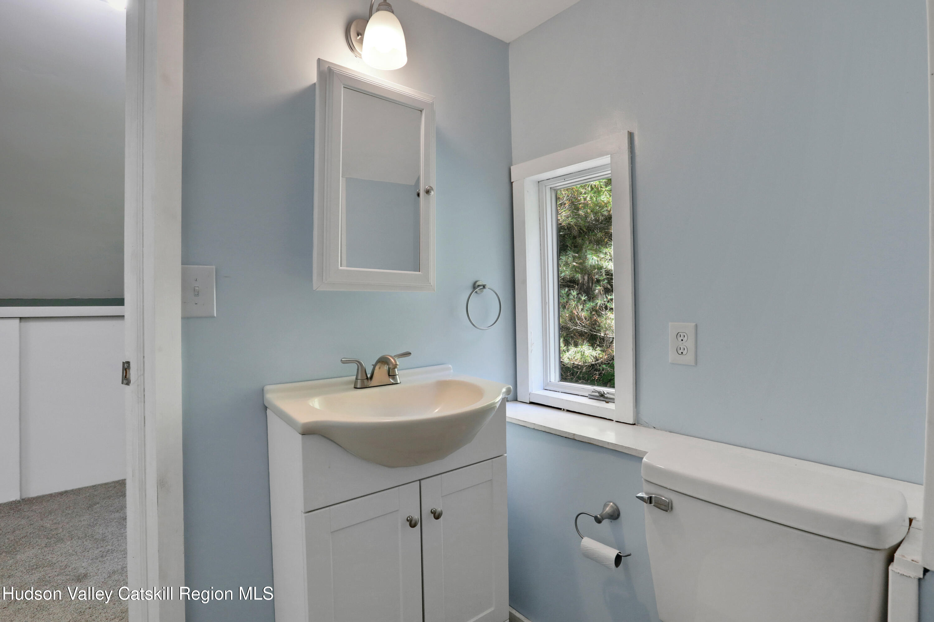 197 Old Rte 32 Saugerties, NY 12477 - Photo 20 of 31 a bathroom with a sink a toilet and a mirror