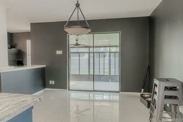 a view of a room with a flat screen tv