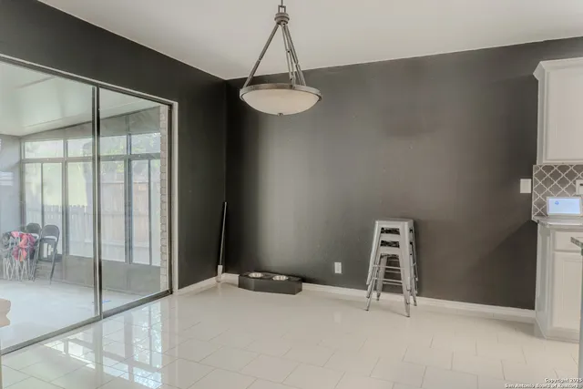 a view of a kitchen with a sink and a window