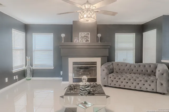 a living room with furniture and a fireplace