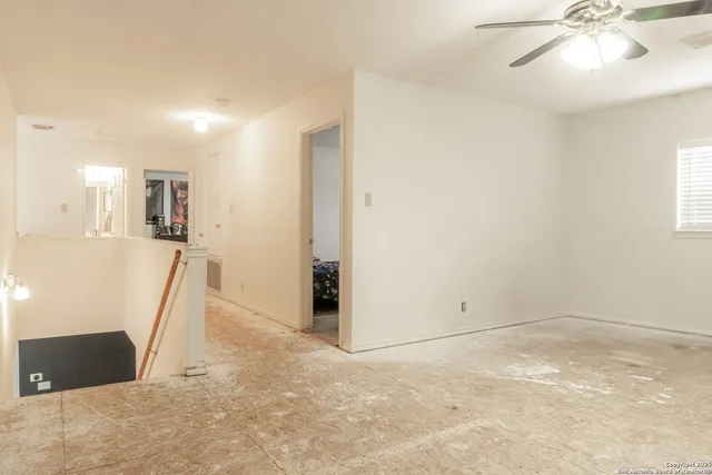 a bedroom with a bed and dresser