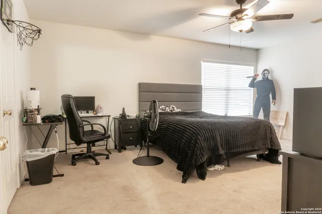 a bathroom with a sink mirror vanity and toilet