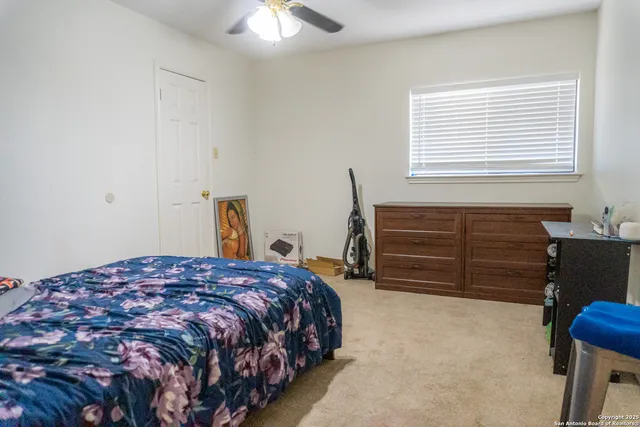 a view of an empty room with stairs
