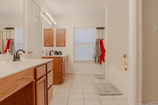 a bathroom with a sink and mirror