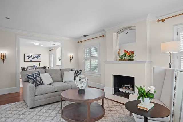 a kitchen with stainless steel appliances kitchen island granite countertop a stove a sink and a refrigerator