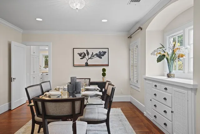 a kitchen with granite countertop a sink stove and cabinets