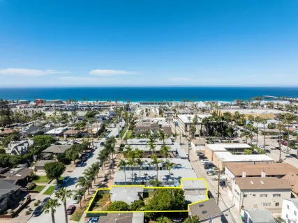 an aerial view of residential building with parking space