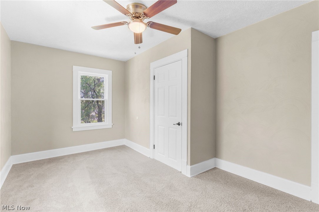 4646 Kirk Road Youngstown, OH 44515 - Photo 11 of 18 Spare room with ceiling fan and carpet floors