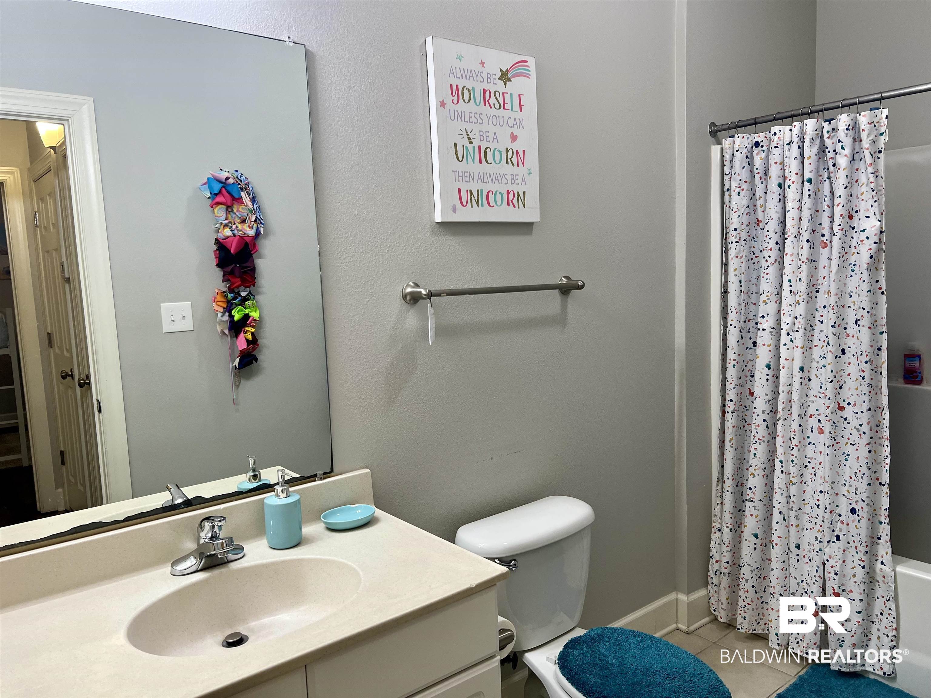 450 Park Avenue, Unit 808 Foley, AL 36535 - Photo 18 of 38 Full bathroom with vanity, shower / tub combo, tile patterned floors, and toilet