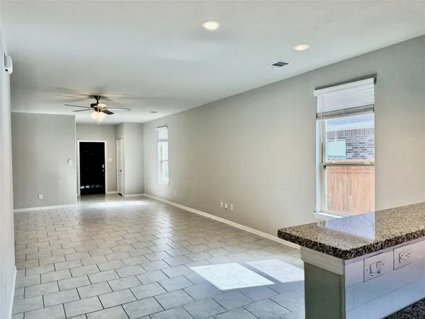 a kitchen with granite countertop stainless steel appliances and wooden cabinets