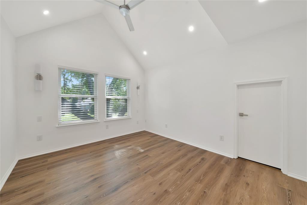 2909 Normandy Court Euless, TX 76039 - Photo 26 of 36 a view of an empty room with wooden floor and a window
