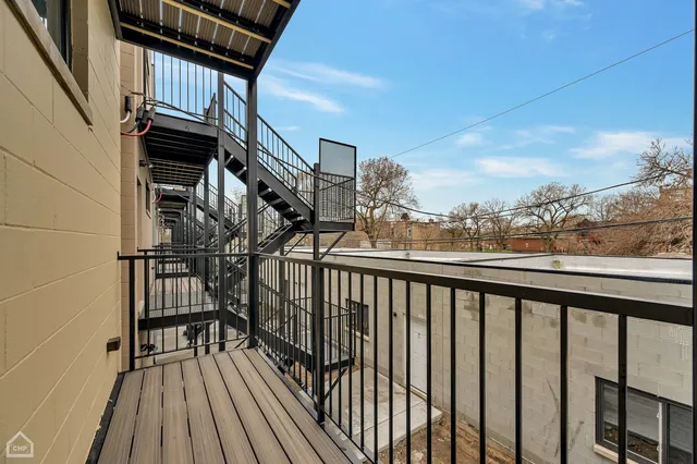 a view of balcony with wooden floor
