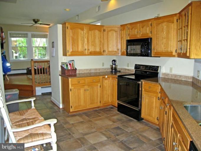2809 Ridge Rd Drive Alexandria, VA 22302 - Photo 12 of 19 a kitchen with a stove a sink and a microwave