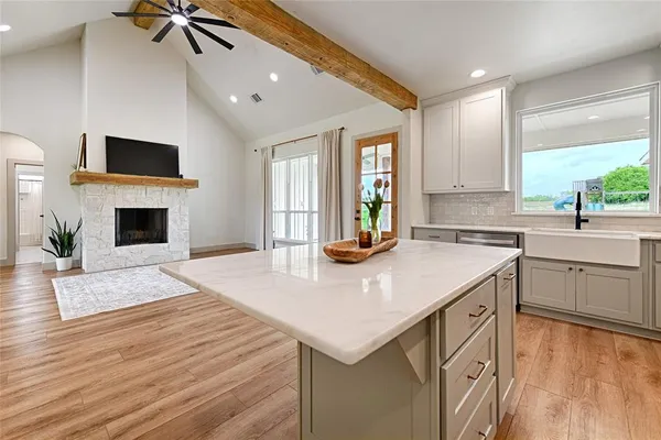 a kitchen with sink cabinets and window
