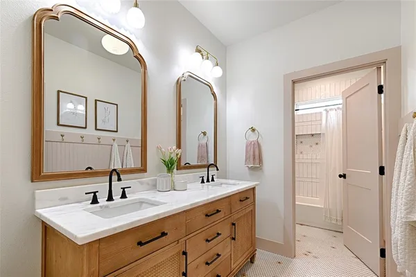 a bathroom with a double vanity sink mirror and next