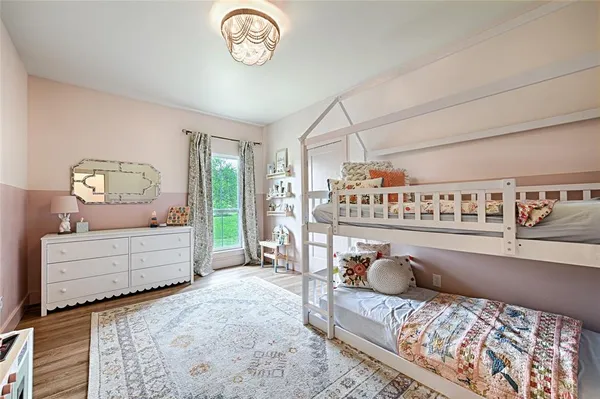 a bedroom with furniture and a window
