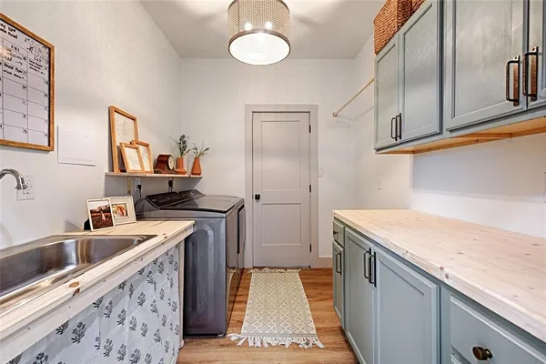 a kitchen that has a sink and a stove