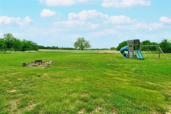 a view of a golf course with a lake