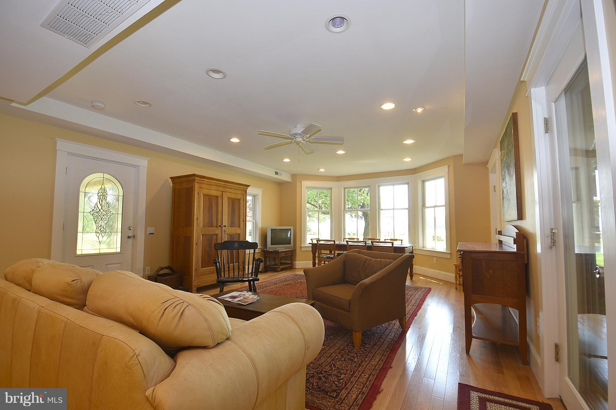 4832 Fairbank Road Tilghman, MD 21671 - Photo 12 of 34 Family room with a view & screen porch access