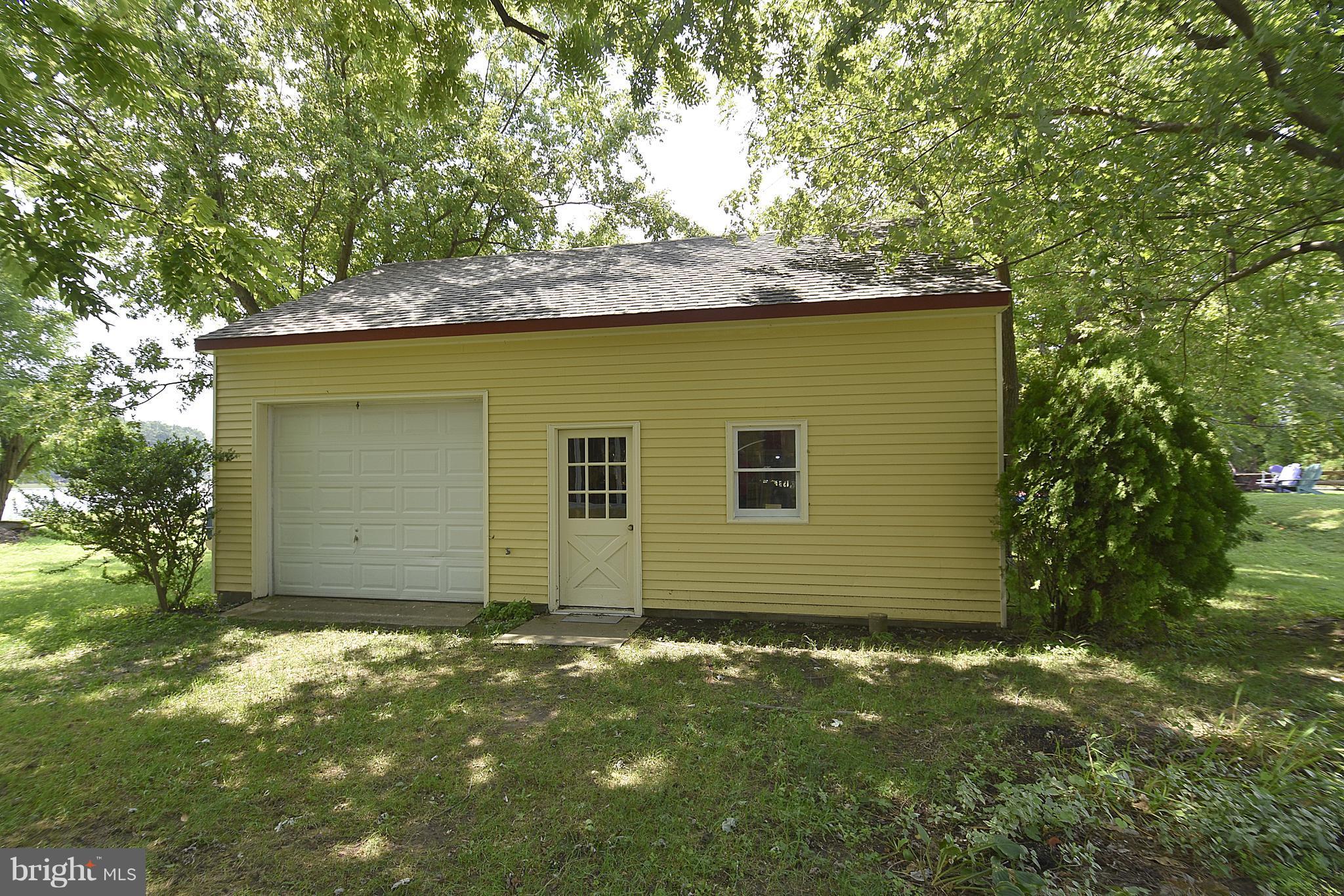4832 Fairbank Road Tilghman, MD 21671 - Photo 27 of 34 Outbuilding with workshop and storage