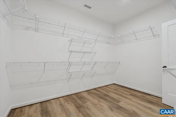 a view of a room with racks on the wall