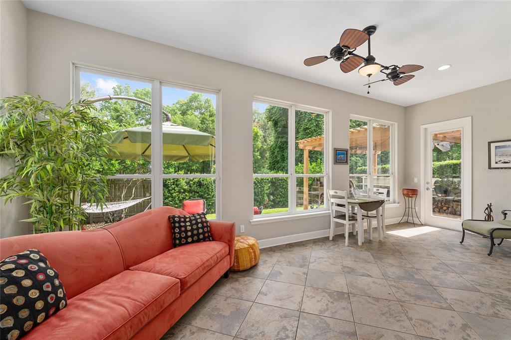 8942 Southwest 25 Road Gainesville, FL 32608 - Photo 6 of 22 a living room with furniture and a large window