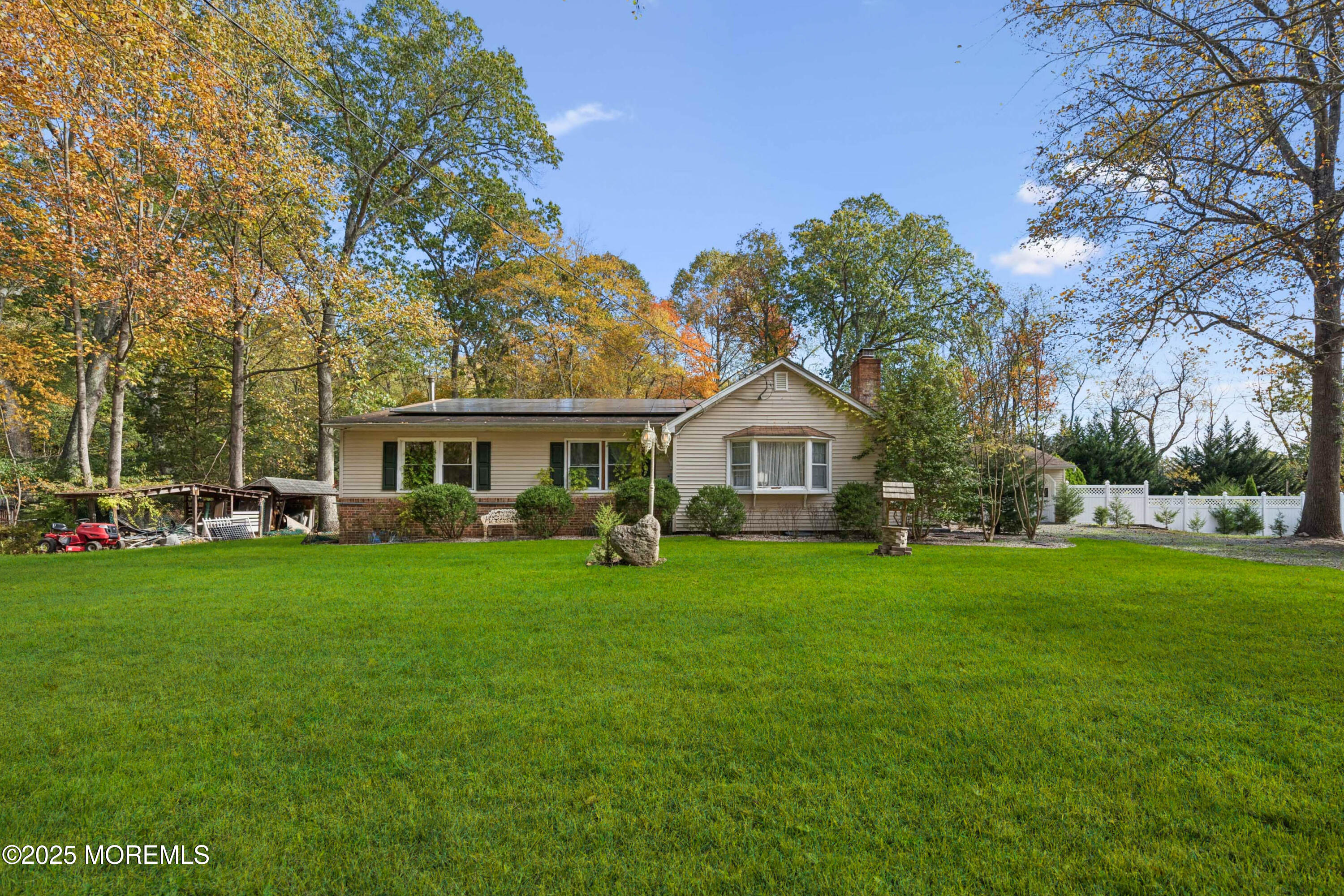 a front view of a house with a garden
