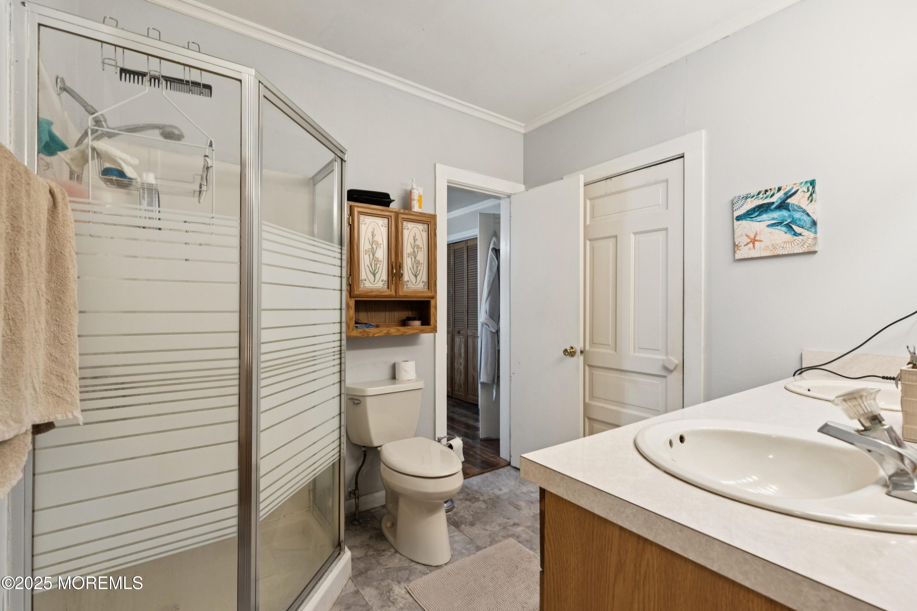 123 Georgia Road Freehold, NJ 07728 - Photo 19 of 25 a bathroom with a sink a toilet and shower