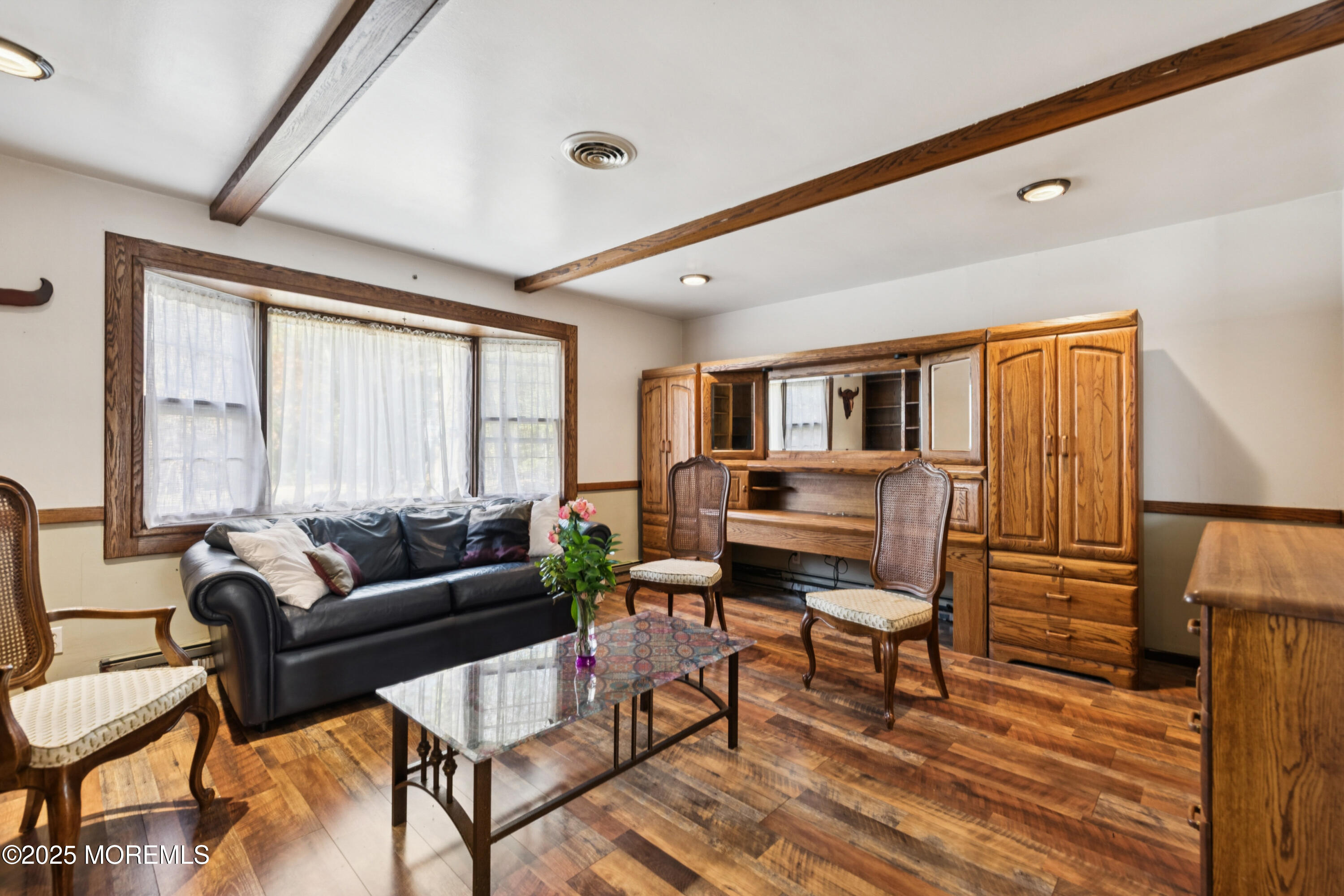 123 Georgia Road Freehold, NJ 07728 - Photo 2 of 25 a living room with furniture and a wooden floor