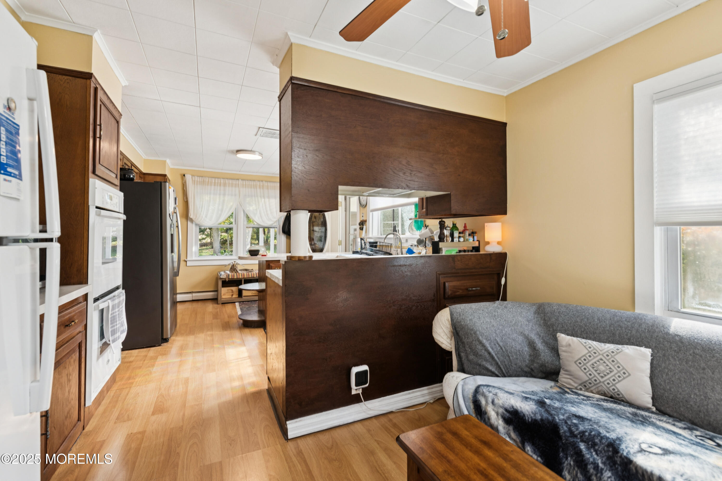 123 Georgia Road Freehold, NJ 07728 - Photo 10 of 25 a living room with furniture and a flat screen tv