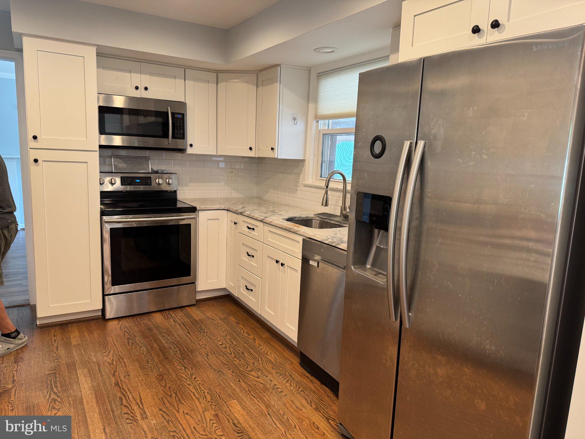 6603 Huntsman Boulevard Springfield, VA 22152 - Photo 10 of 64 Modern kitchen with sleek appliances.