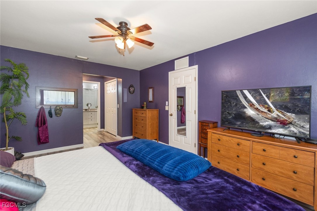 2005 Mc Arthur Avenue Alva, FL 33920 - Photo 16 of 32 a bedroom with a bed and a flat screen tv