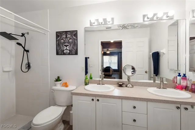 a bathroom with a sink toilet and vanity