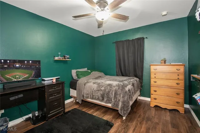 a bedroom with a bed and a fireplace