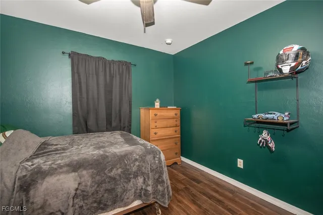 a bedroom with a bed and a table