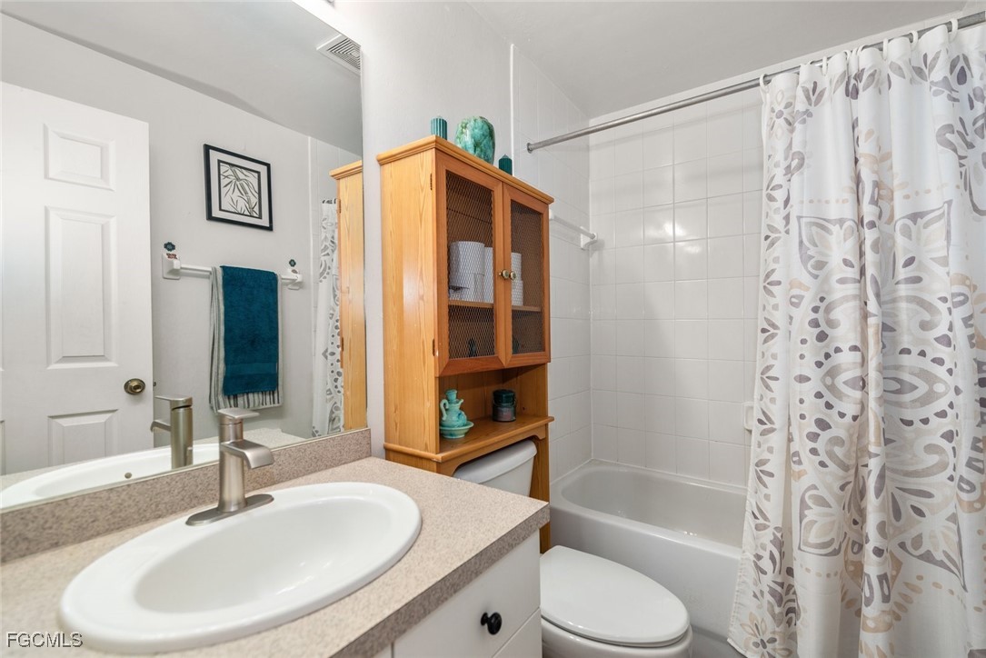 2005 Mc Arthur Avenue Alva, FL 33920 - Photo 22 of 32 a bathroom with a sink toilet and shower