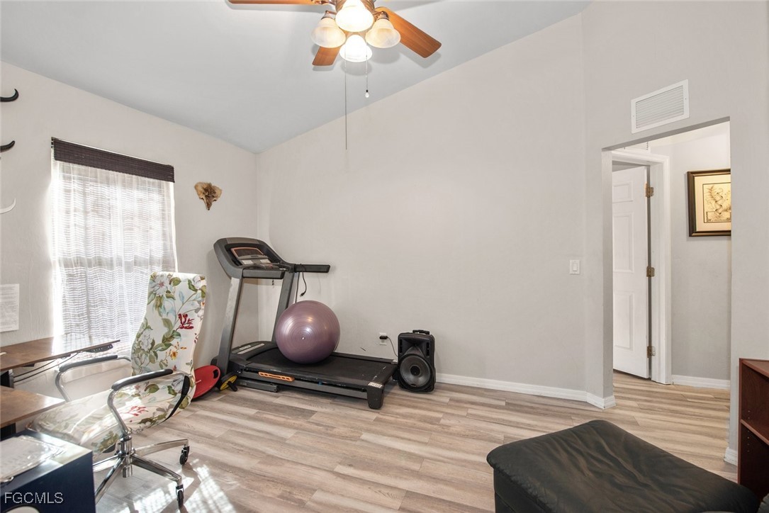 2005 Mc Arthur Avenue Alva, FL 33920 - Photo 25 of 32 a view of room with wooden floor and windows