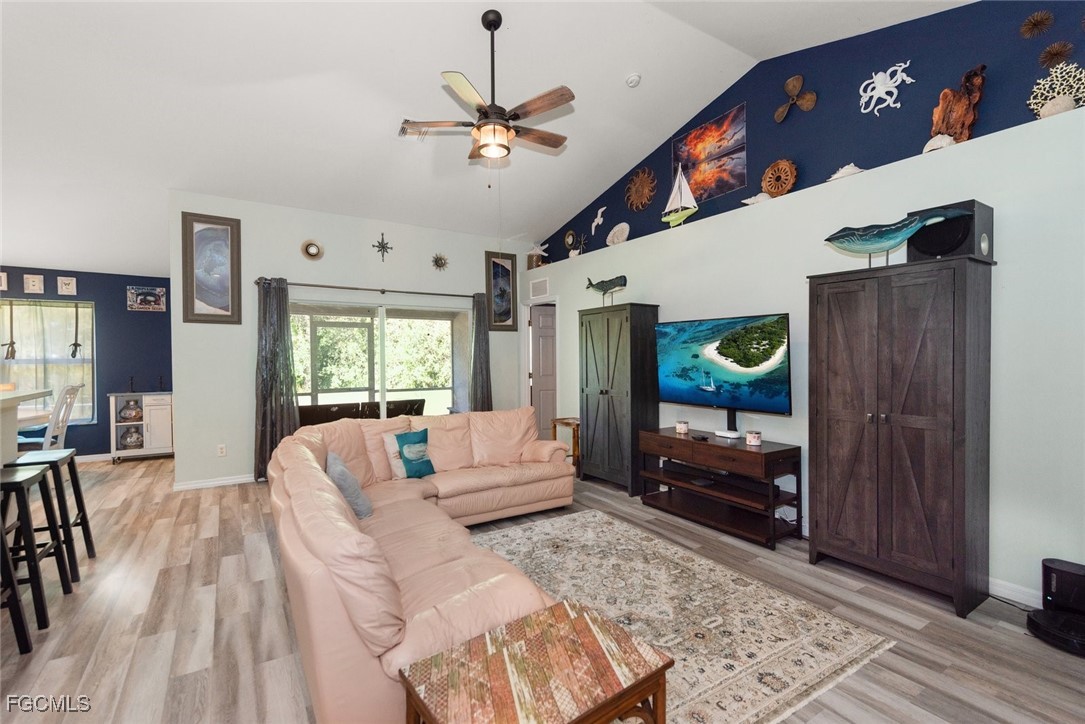 2005 Mc Arthur Avenue Alva, FL 33920 - Photo 4 of 32 a living room with furniture and a chandelier