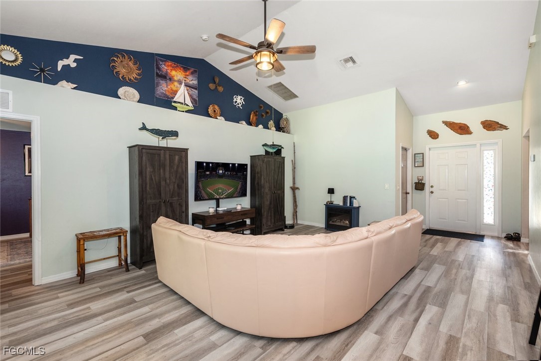 2005 Mc Arthur Avenue Alva, FL 33920 - Photo 7 of 32 a living room with furniture and a fireplace