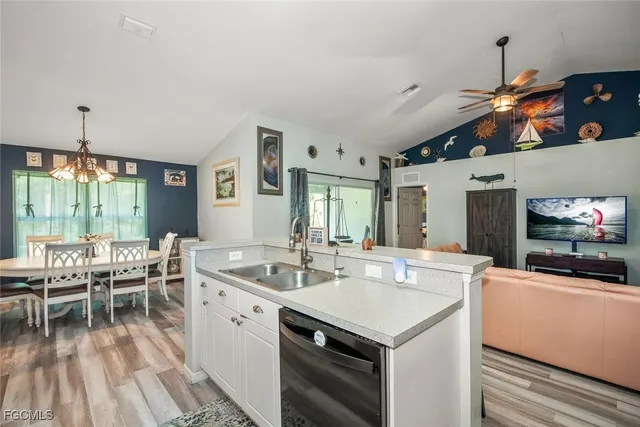 a kitchen with stainless steel appliances granite countertop a stove and a refrigerator