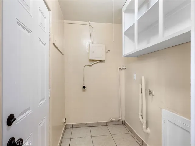 a bathroom with a glass shower door and a glass door