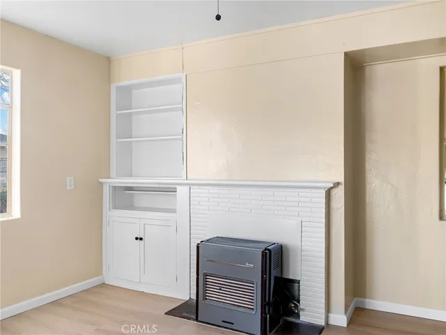 a room with a desk and mirror