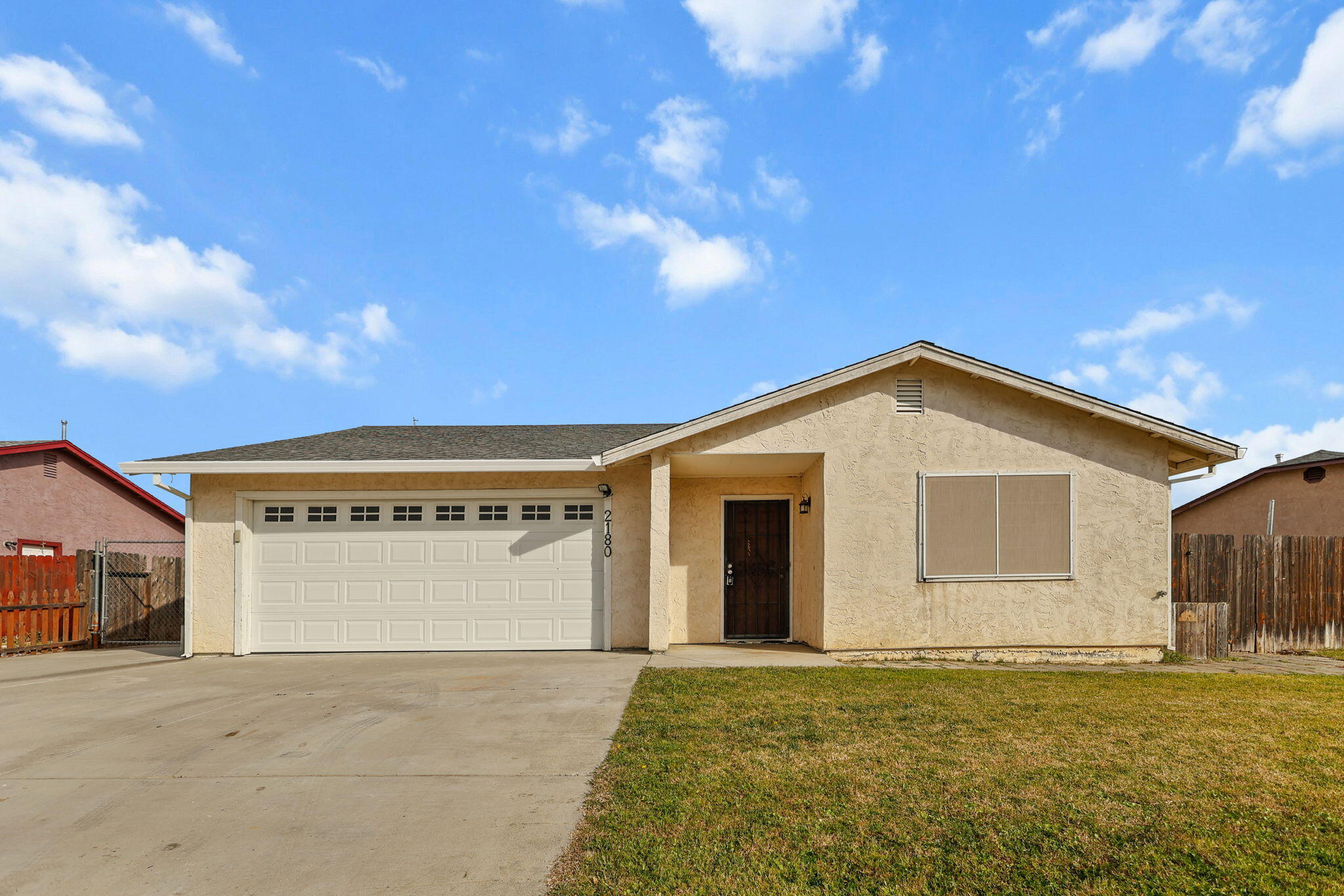 a front view of a house with a yard