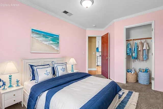 a bedroom with a bed and a lamp