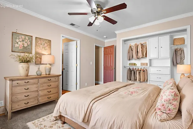 a bedroom with a bed and a dresser