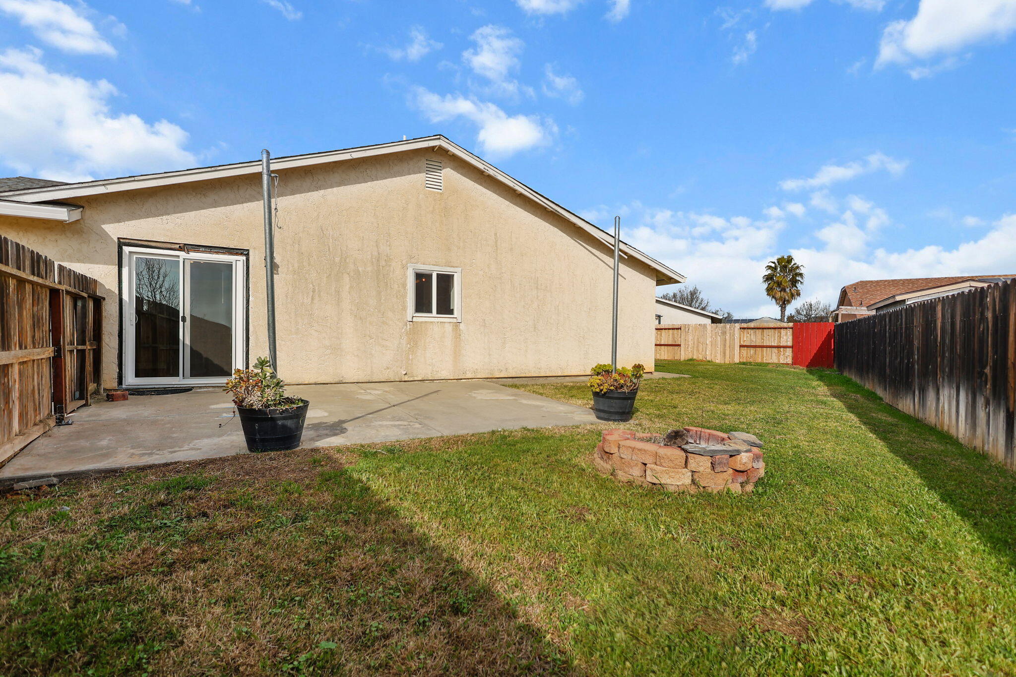 2180 Gentry Way Red Bluff, CA 96080 - Photo 22 of 27 a backyard of a house with table and chairs