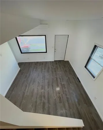 a view of a hallway with staircase
